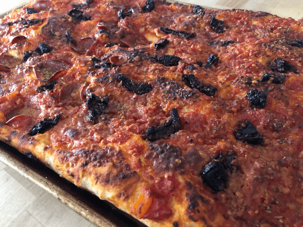 Grandmas pizza with sundried tomatoes and pepperoni